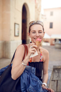 Portrait of mature woman eating ice cream