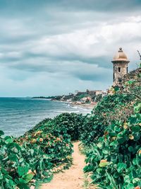 Scenic view of sea against cloudy sky