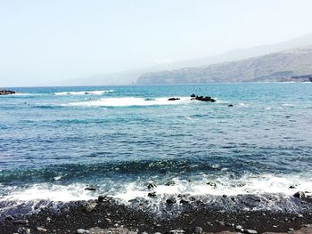 Scenic view of sea against clear sky