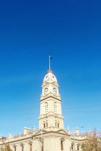 Low angle view of building against blue sky