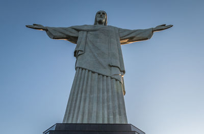 Low angle view of statue against sky