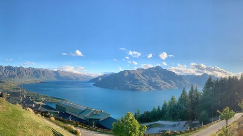 Panoramic view of mountains against blue sky