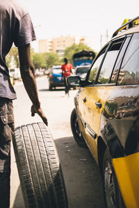 Man walking on road in city