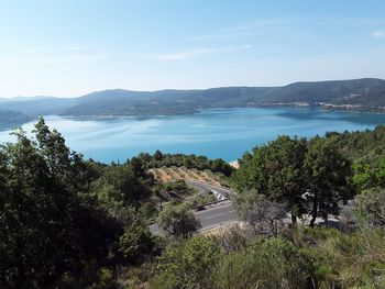 High angle view of trees by sea against sky