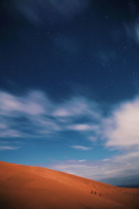 Scenic view of landscape against sky at night