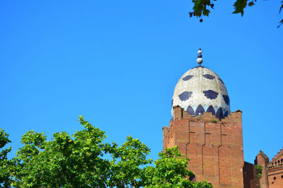 Low angle view of monument against blue sky