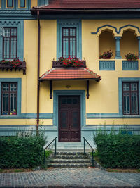 Colorful house facade, vintage style with retro porch and awning. traditional european building
