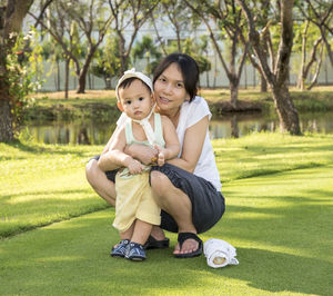 Portrait of mother and daughter at park