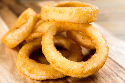 Close-up of onion rings on cutting board