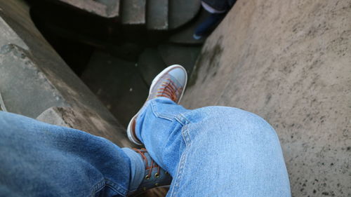 Low section of man wearing shoes