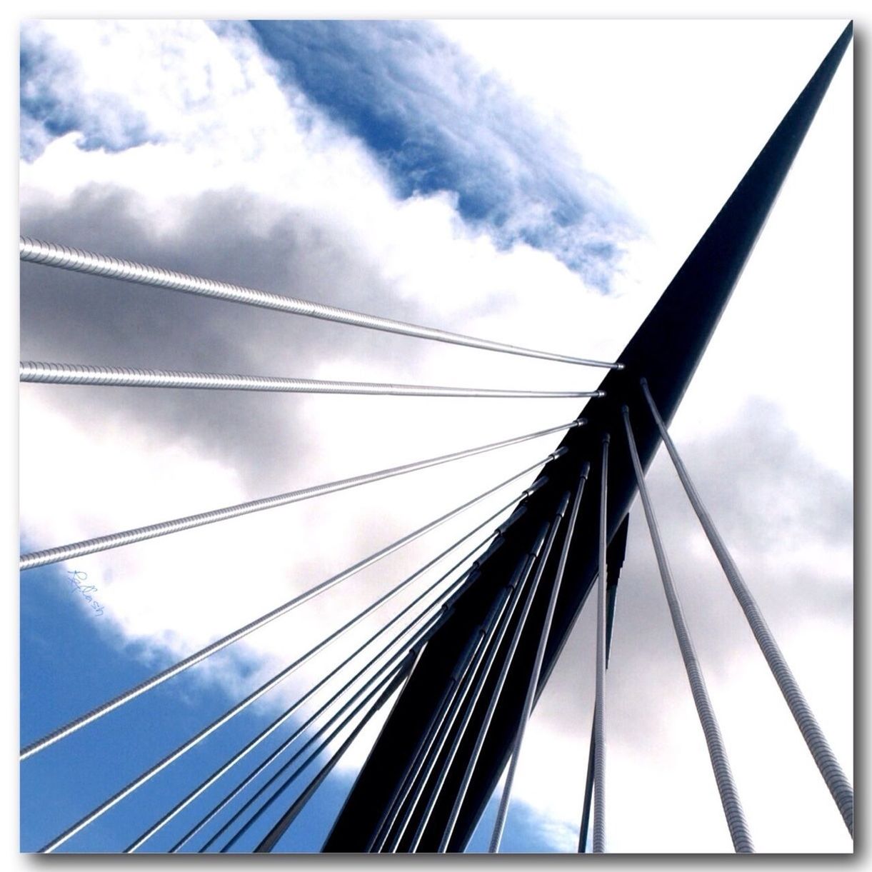 low angle view, sky, transfer print, built structure, architecture, cloud - sky, auto post production filter, connection, cloud, cloudy, bridge - man made structure, engineering, bridge, modern, day, no people, outdoors, railing, building exterior, part of