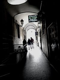 Full length of woman walking in tunnel