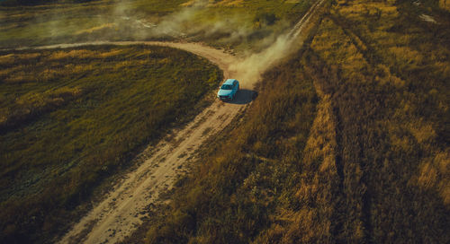 High angle view of car moving on road