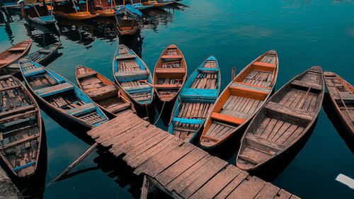 High angle view of boats moored at harbor