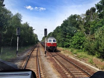 Railroad tracks seen through train windshield