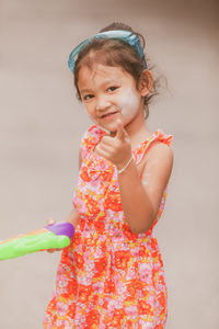 Portrait of cute girl standing outdoors