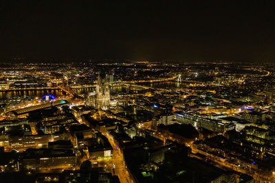 High angle view of illuminated buildings in city at night