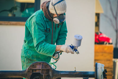 Man working with umbrella