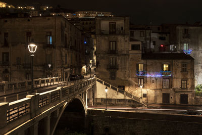 Illuminated buildings in city at night