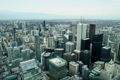 High angle view of modern buildings in city against sky