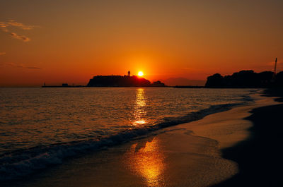 Scenic view of sea against romantic sky at sunset