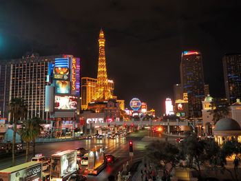 Illuminated buildings in city at night