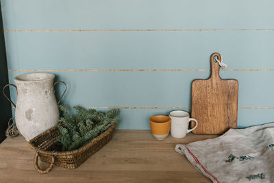 Close-up of the kitchen interior. christmas decoration. fir branches in a wicker basket