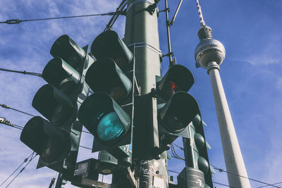 Low angle view of stoplights against fernsehturm