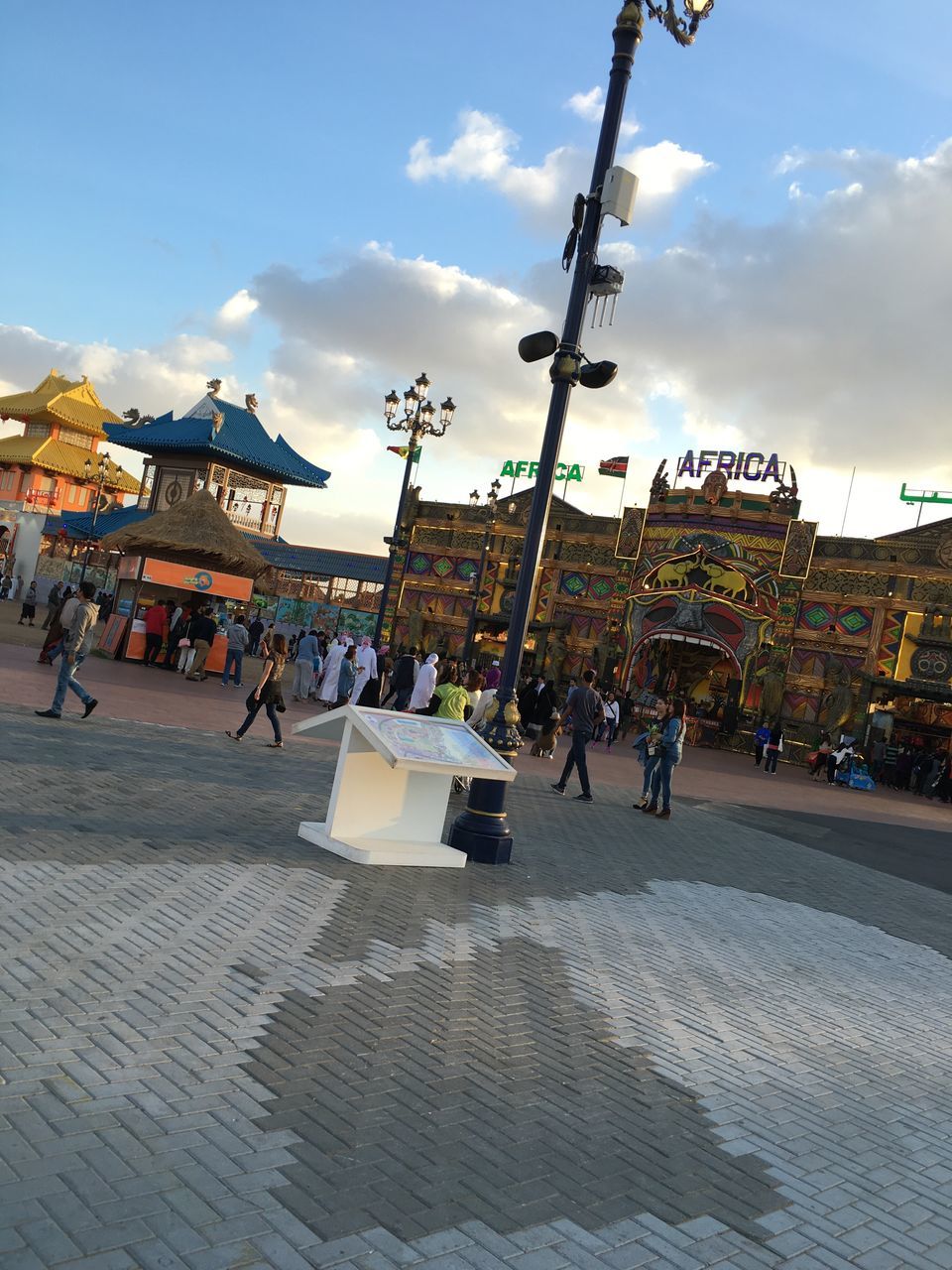 sky, architecture, built structure, cloud - sky, city, market, cloud, leisure activity, lifestyles, outdoors, market stall, day, retail, large group of objects, city life, abundance, cloudy, arrangement, travel destinations, sunny