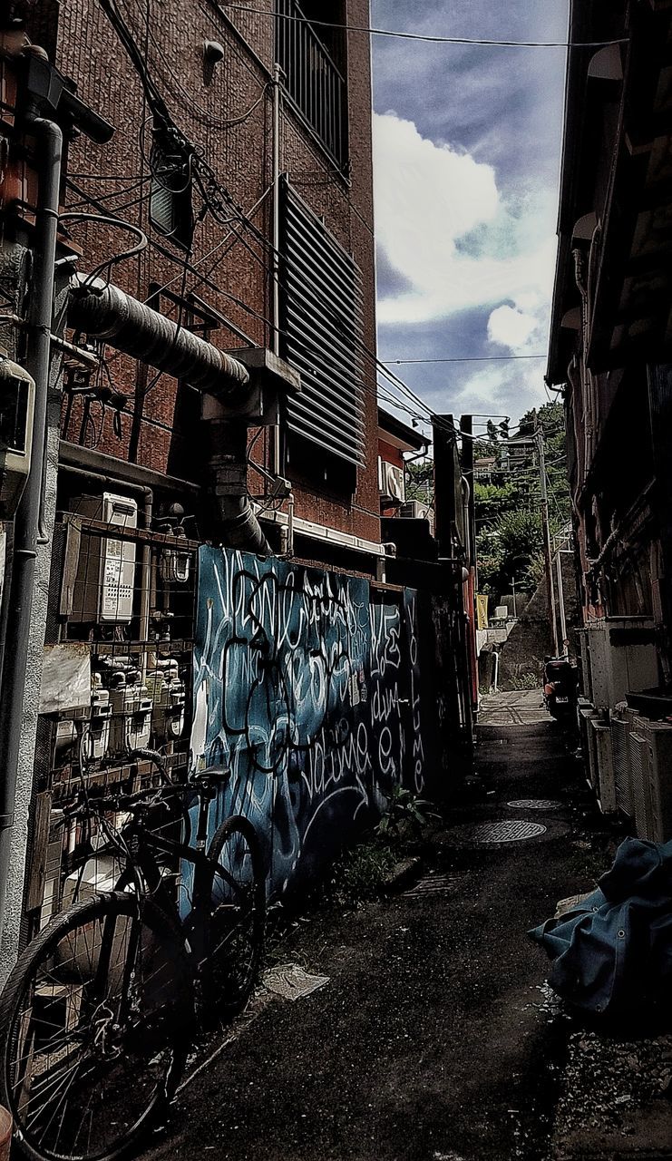 architecture, built structure, building exterior, bicycle, day, outdoors, city, transportation, garbage, mode of transport, no people, cloud - sky, sky