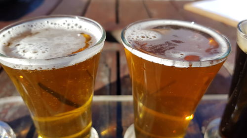 Close-up of beer glass on table