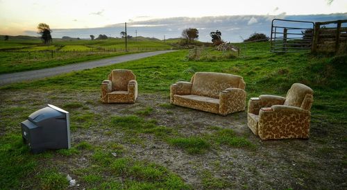Television set and sofa in field
