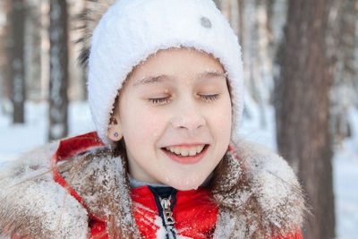 Portrait of smiling boy in snow