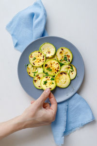 High angle view of person hand on table
