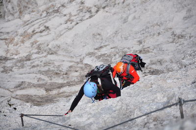High angle view of man skiing on rock