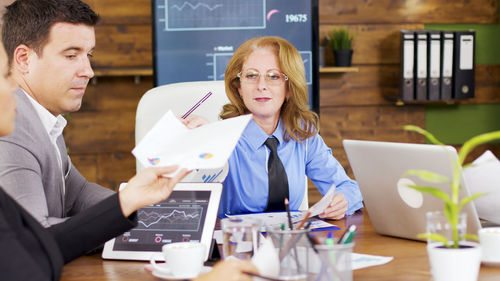 Portrait of businesswoman using digital tablet in office