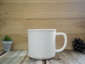 Close-up of coffee cup on table