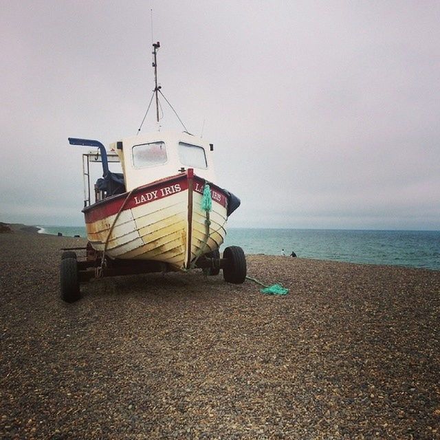 sea, horizon over water, beach, sky, shore, sand, water, transportation, mode of transport, nautical vessel, tranquility, tranquil scene, boat, cloud - sky, nature, scenics, outdoors, beauty in nature, travel