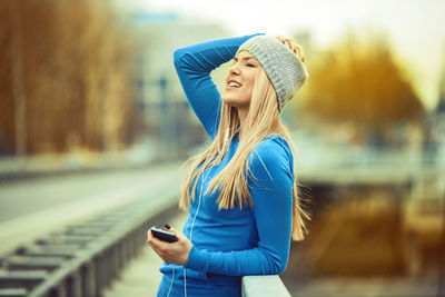 Young woman using mobile phone outdoors