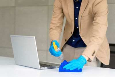 Low angle view of man working on table