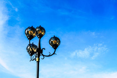 Low angle view of street light against sky