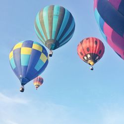 Low angle view of hot air balloon against blue sky