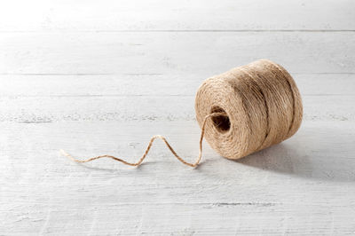 Close-up of string roll on table