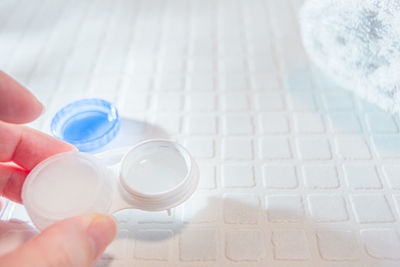 Close-up of hand holding eyeglasses