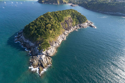 High angle view of rocks on sea shore