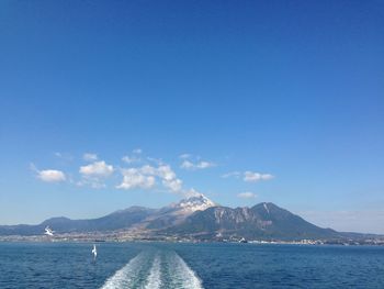 Scenic view of sea against blue sky