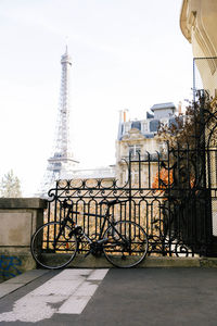 Bicycles against sky in city