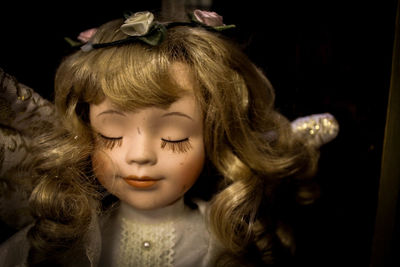 Close-up of doll in darkroom