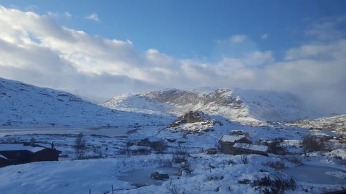 Scenic view of snowcapped mountains against sky