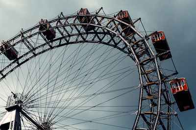 Low angle view of ferris wheel against sky